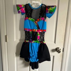 blue leotard with skirt and shoulder pads.